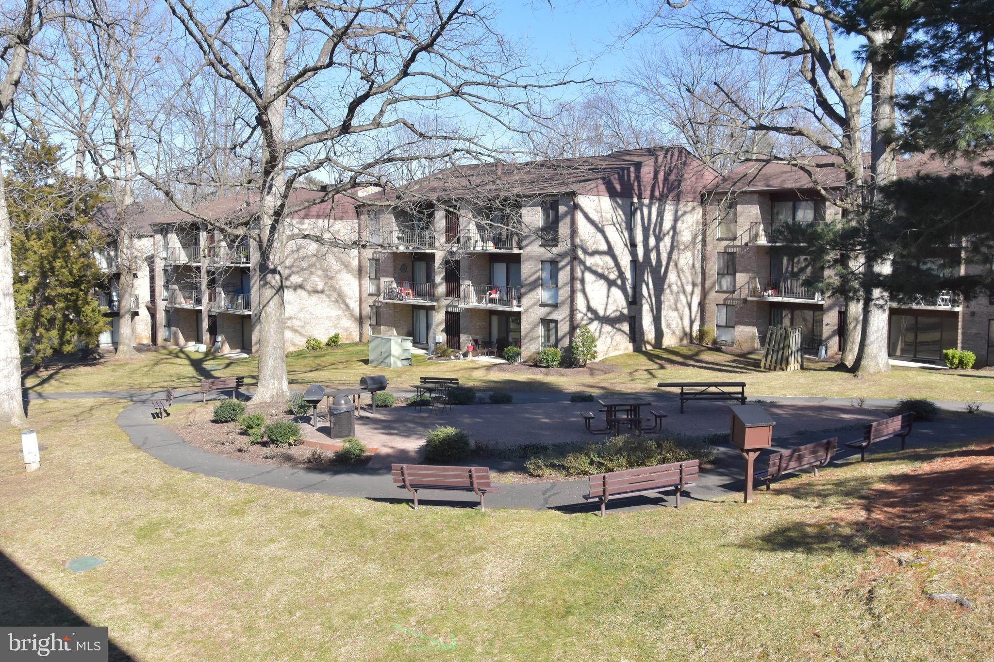 2050 Royal Fern Court, Unit 11A Reston, VA 20191 - Photo 8 of 17 a swimming pool with outdoor seating