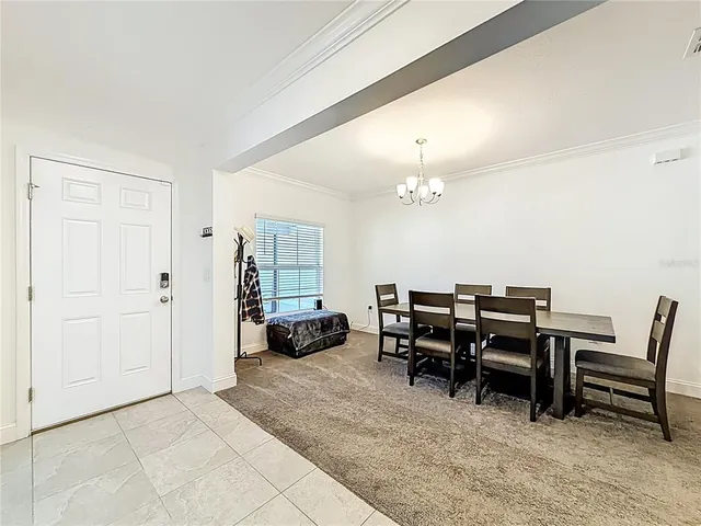 a kitchen with kitchen island granite countertop a sink and stainless steel appliances
