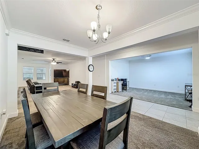 a kitchen with stainless steel appliances granite countertop a sink and a refrigerator