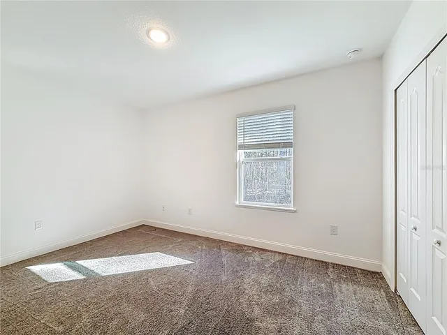 a dining room with furniture and a chandelier