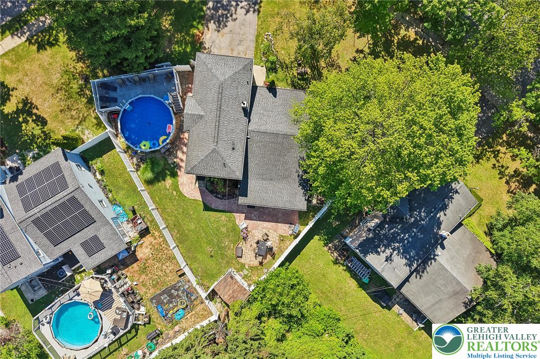2649 Nottingham Road Bethlehem, PA 18017 - Photo 42 of 49 An aerial perspective reveals a private yard with a refreshing pool, ample deck space, and a cozy patio.