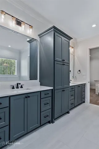 a bathroom with a double vanity sink mirror and double
