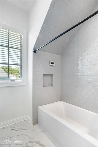 a bathroom with a bathtub
