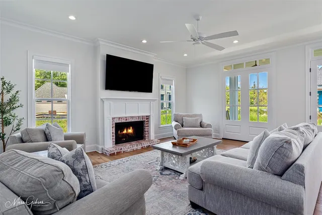 a living room with furniture fireplace and a flat screen tv
