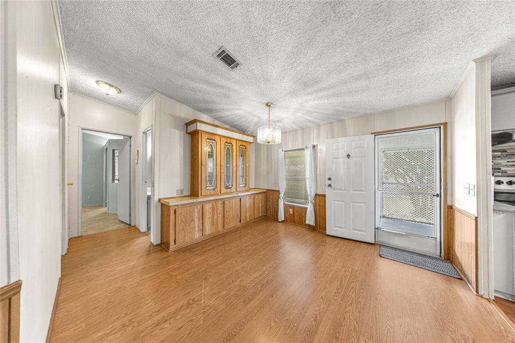 6366 Southwest 84th Lane Ocala, FL 34476 - Photo 12 of 40 a large space with a large window and wooden floor