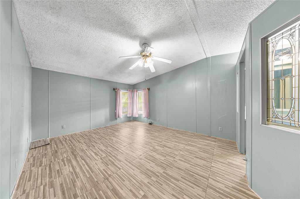 6366 Southwest 84th Lane Ocala, FL 34476 - Photo 13 of 40 wooden floor in an empty room with a window