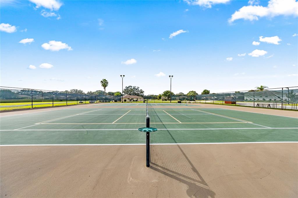 6366 Southwest 84th Lane Ocala, FL 34476 - Photo 34 of 40 a view of an outdoor space and tennis court