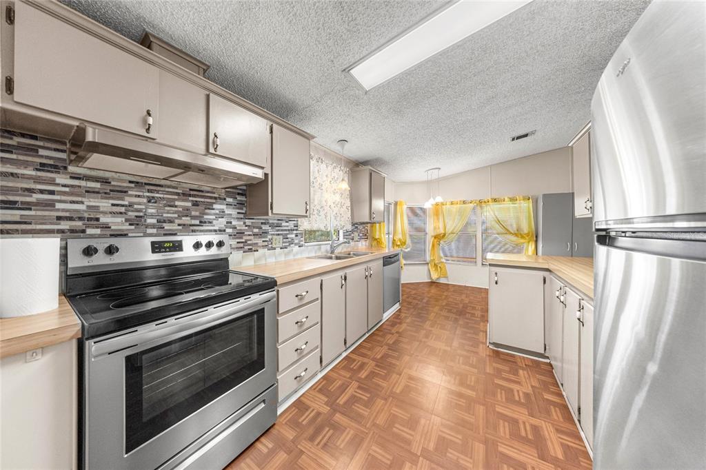 6366 Southwest 84th Lane Ocala, FL 34476 - Photo 6 of 40 a kitchen with a stove oven and sink