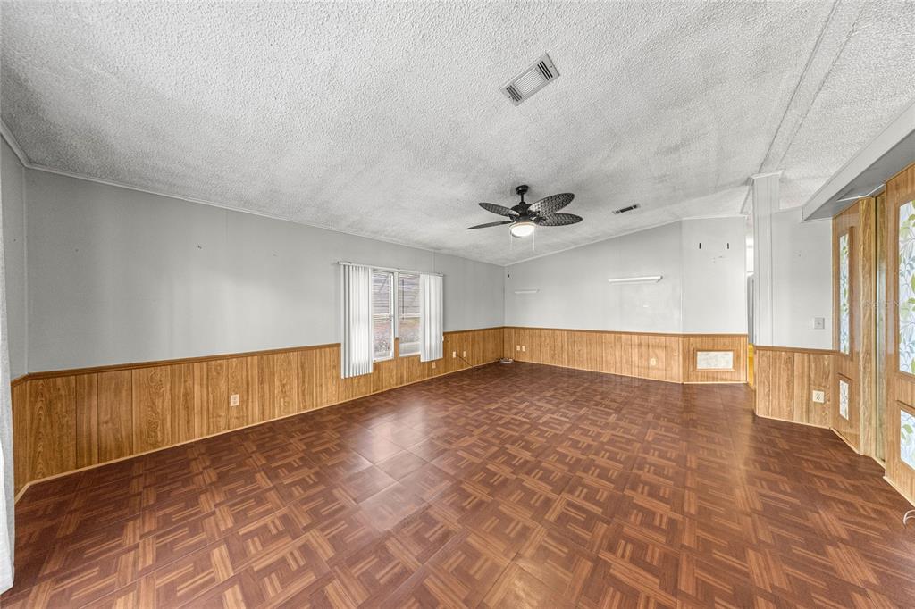 6366 Southwest 84th Lane Ocala, FL 34476 - Photo 9 of 40 wooden floor in an empty room with a window