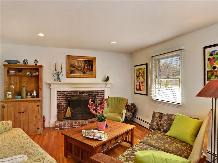 11 Crowell Road Sandwich, MA 02563 - Photo 2 of 19 a living room with furniture and a fireplace