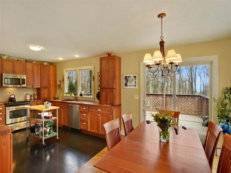 11 Crowell Road Sandwich, MA 02563 - Photo 5 of 19 a view of a dining room and livingroom with furniture wooden floor a chandelier