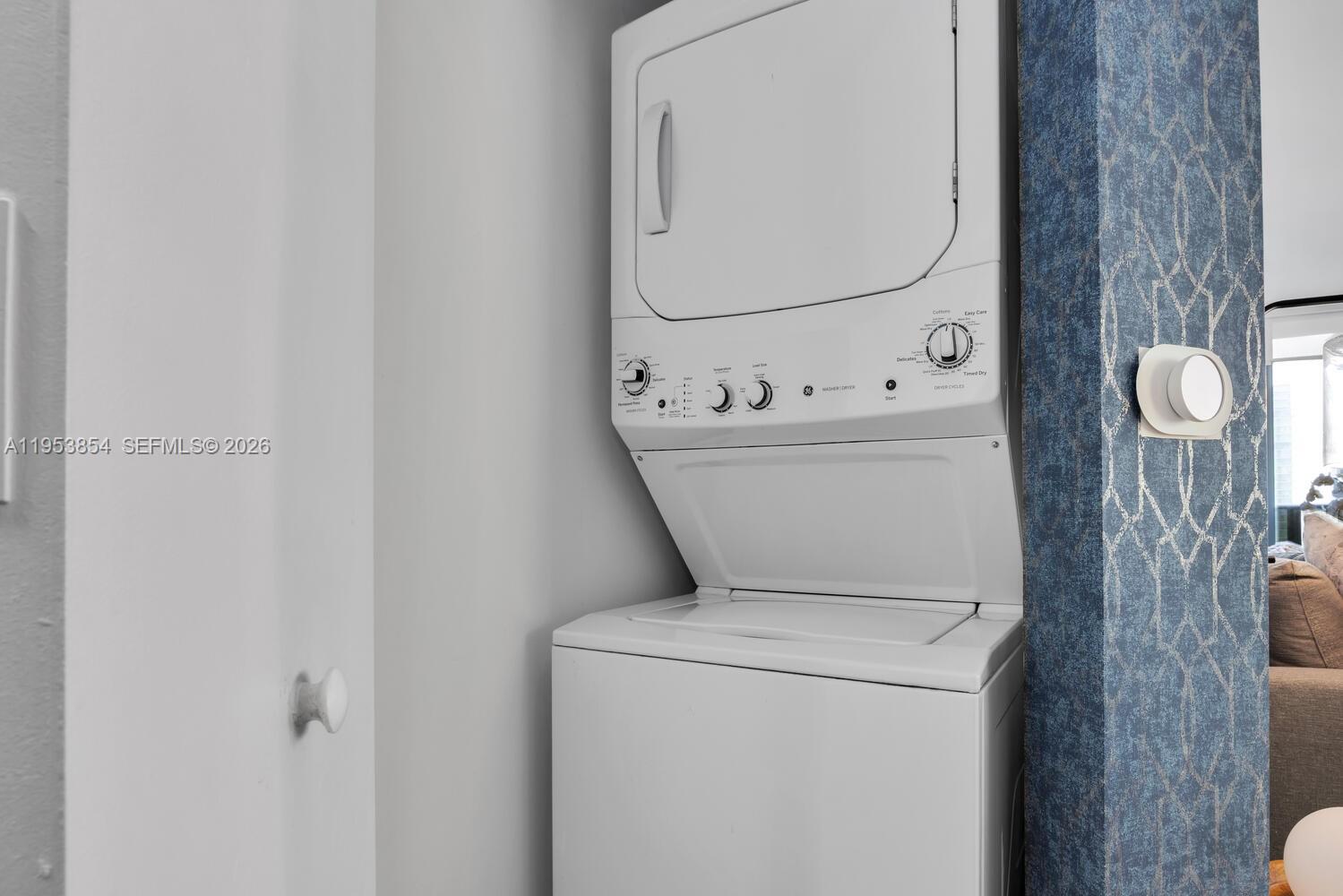 55 Southwest 9th Street, Unit 2406 Miami, FL 33130 - Photo 19 of 38 a utility room with dryer and washer