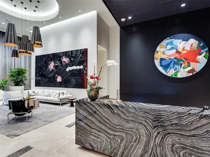 a bedroom with a bed a rug and wall painting