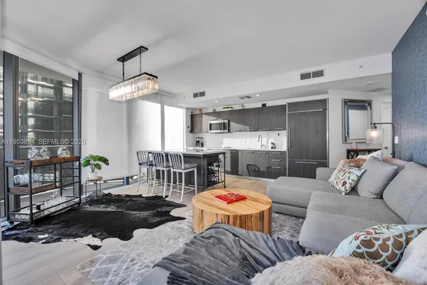 a living room with furniture and a table
