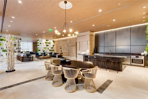 a kitchen with kitchen island granite countertop a table and chairs