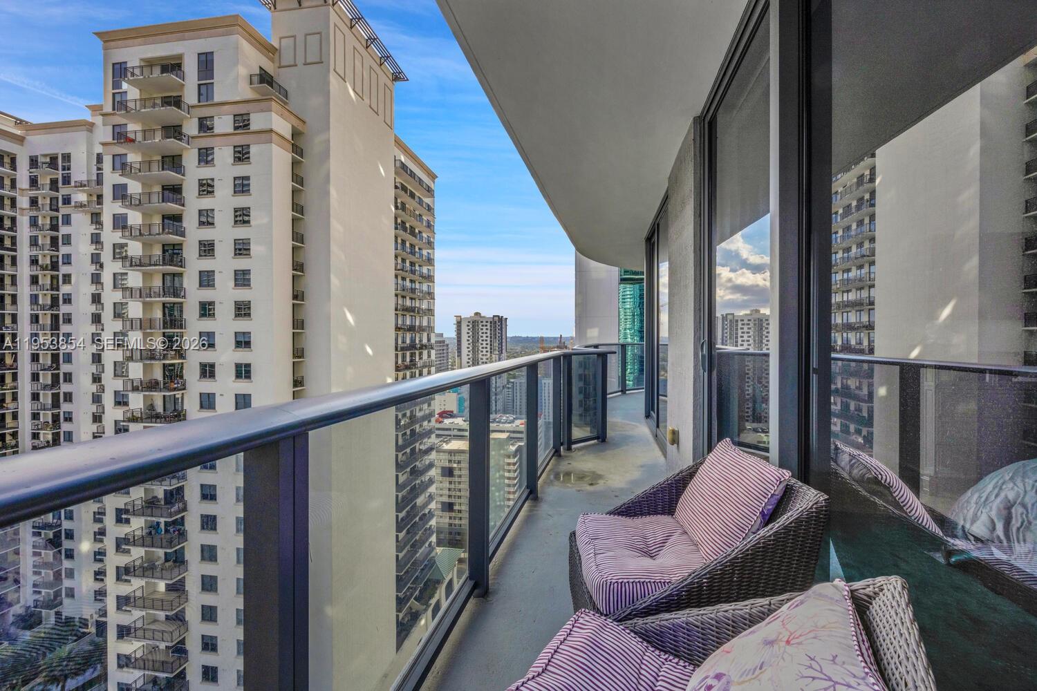 55 Southwest 9th Street, Unit 2406 Miami, FL 33130 - Photo 7 of 38 a balcony with furniture