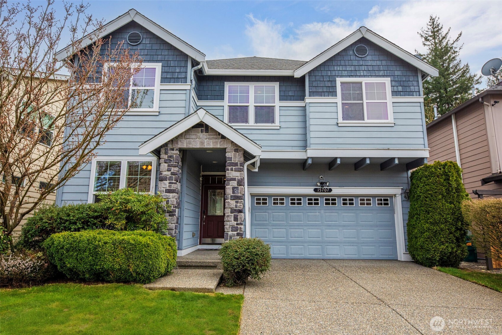 15707 36th Drive Southeast Bothell, WA 98012 - Photo 1 of 35 a front view of a house with a yard and garage
