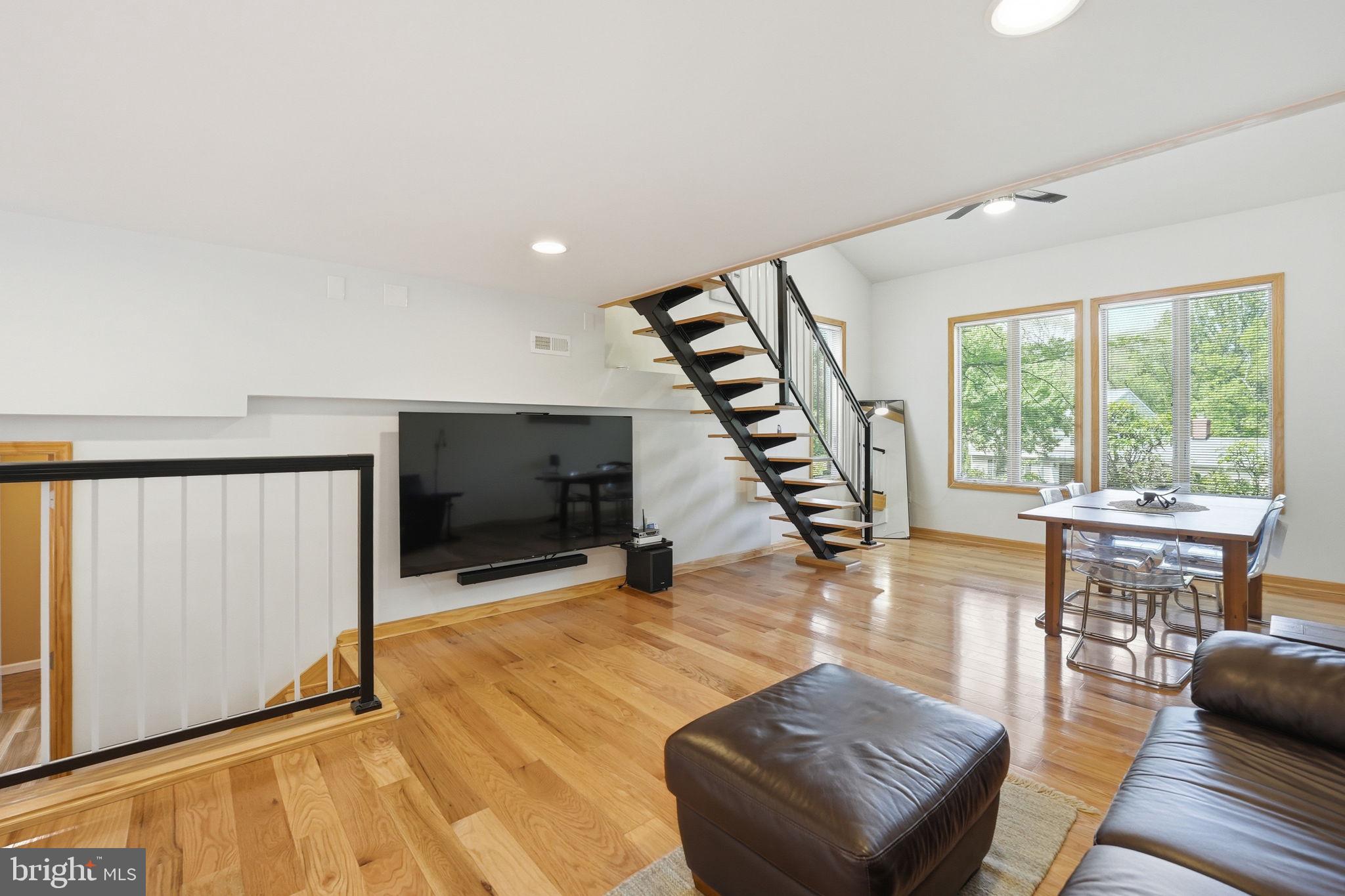 10929 Howland Drive Reston, VA 20191 - Photo 13 of 66 a living room with furniture and a flat screen tv