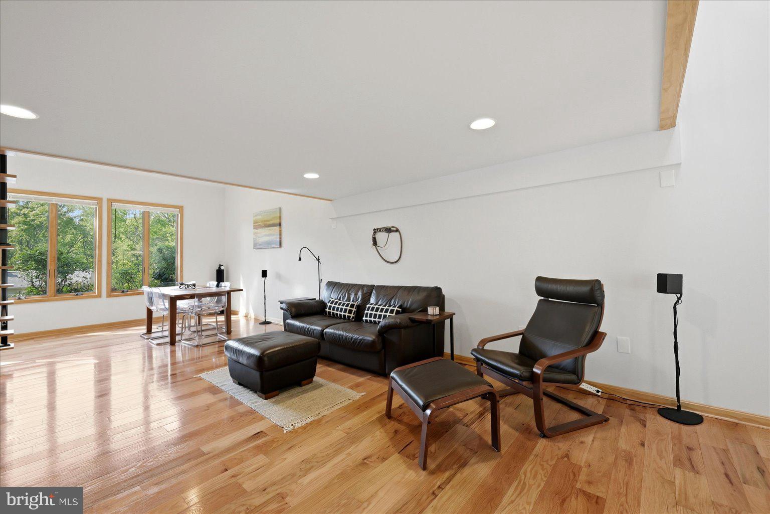 10929 Howland Drive Reston, VA 20191 - Photo 14 of 66 a living room with furniture a wooden floor and a large window