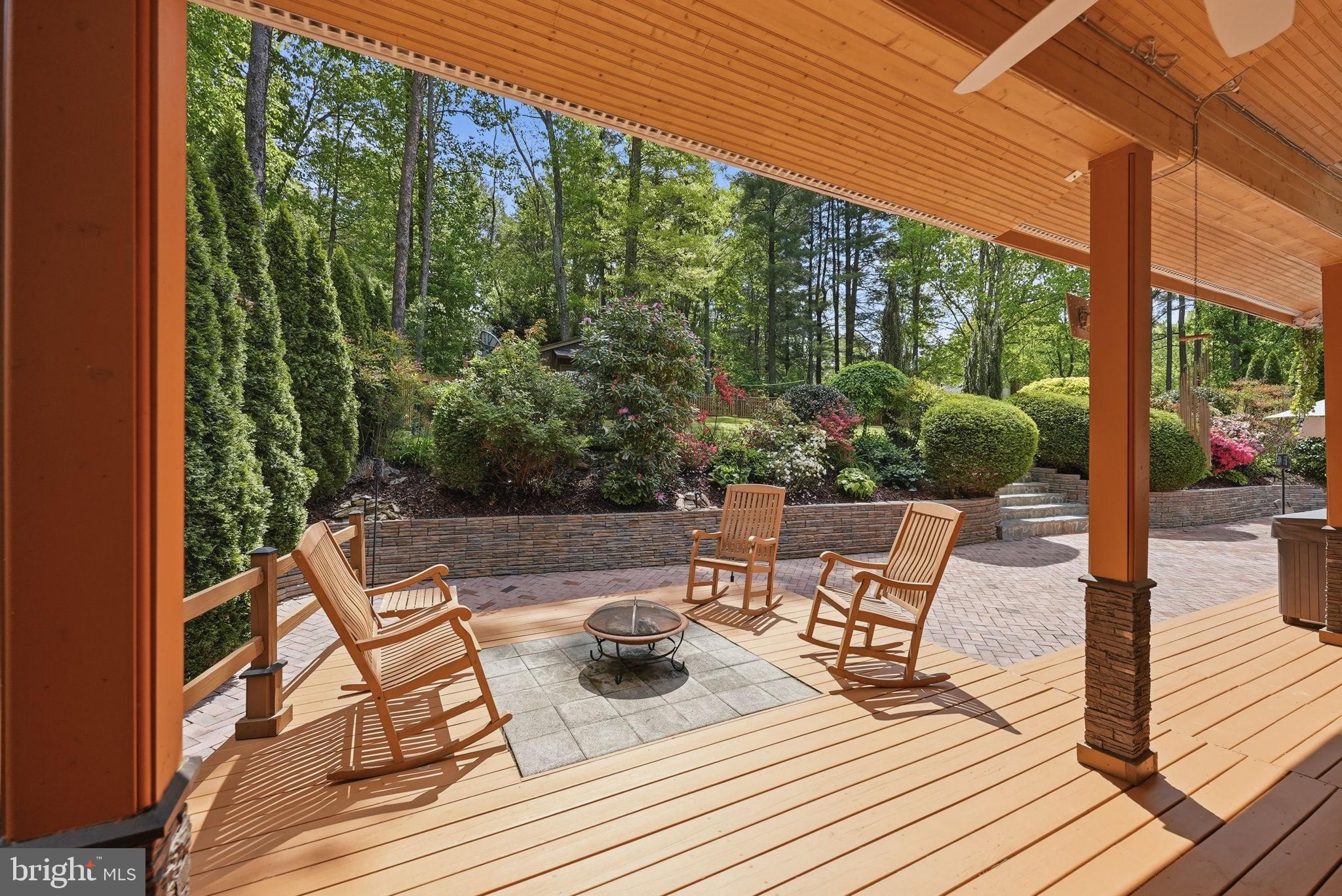 10929 Howland Drive Reston, VA 20191 - Photo 20 of 66 a view of a patio with table and chairs and potted plants