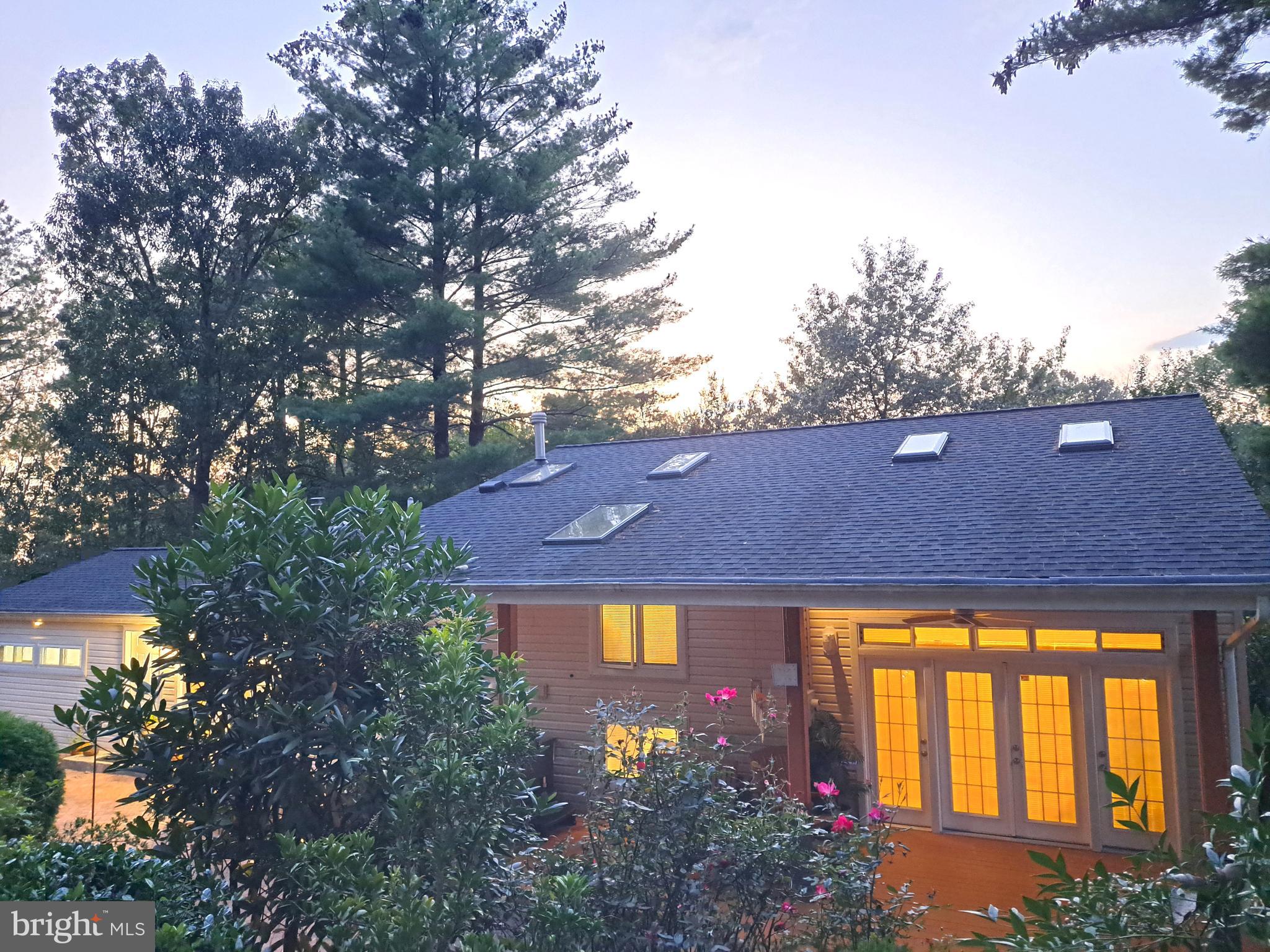 10929 Howland Drive Reston, VA 20191 - Photo 29 of 66 a front view of house with yard and green space