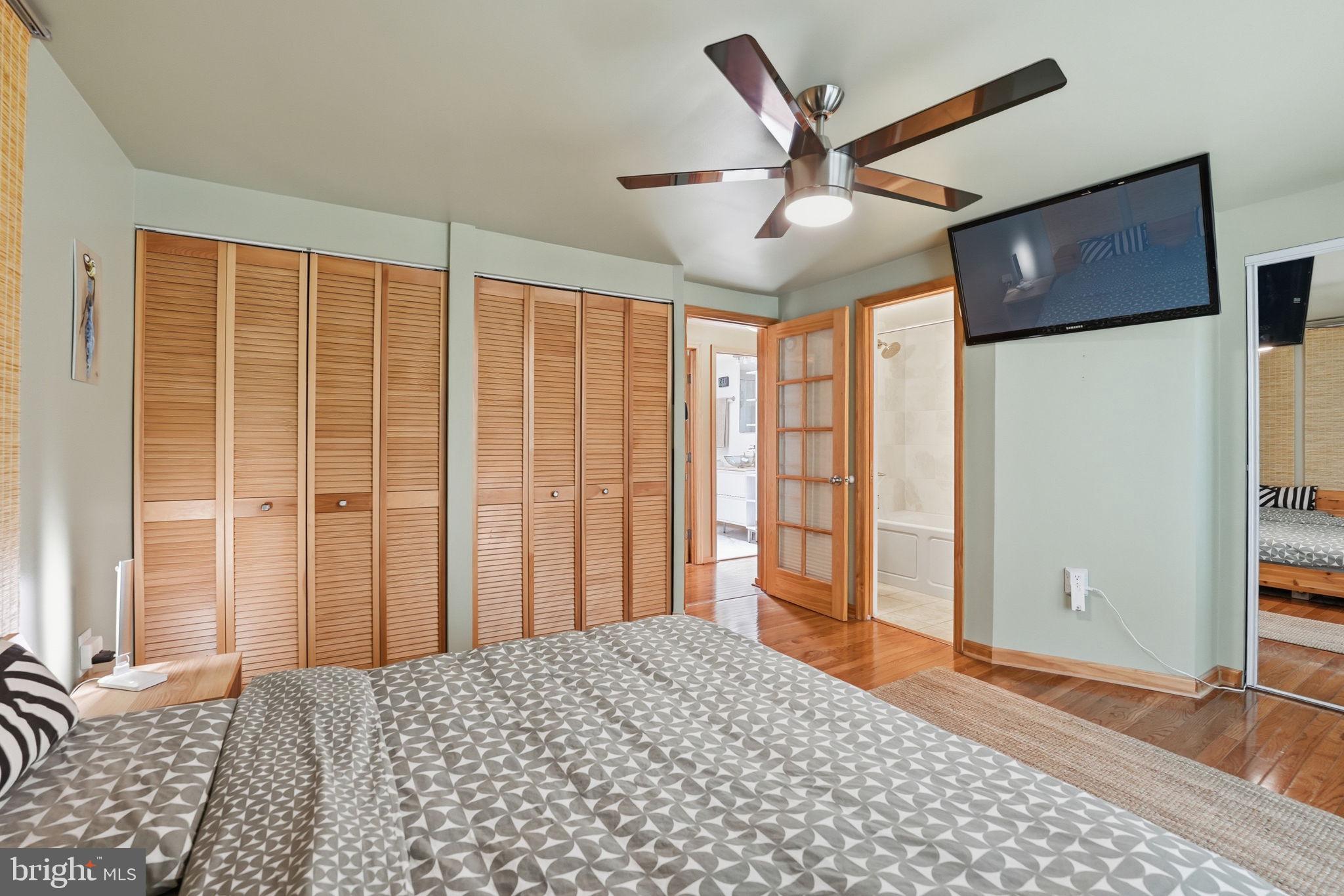 10929 Howland Drive Reston, VA 20191 - Photo 31 of 66 a bedroom with a bed and a chandelier