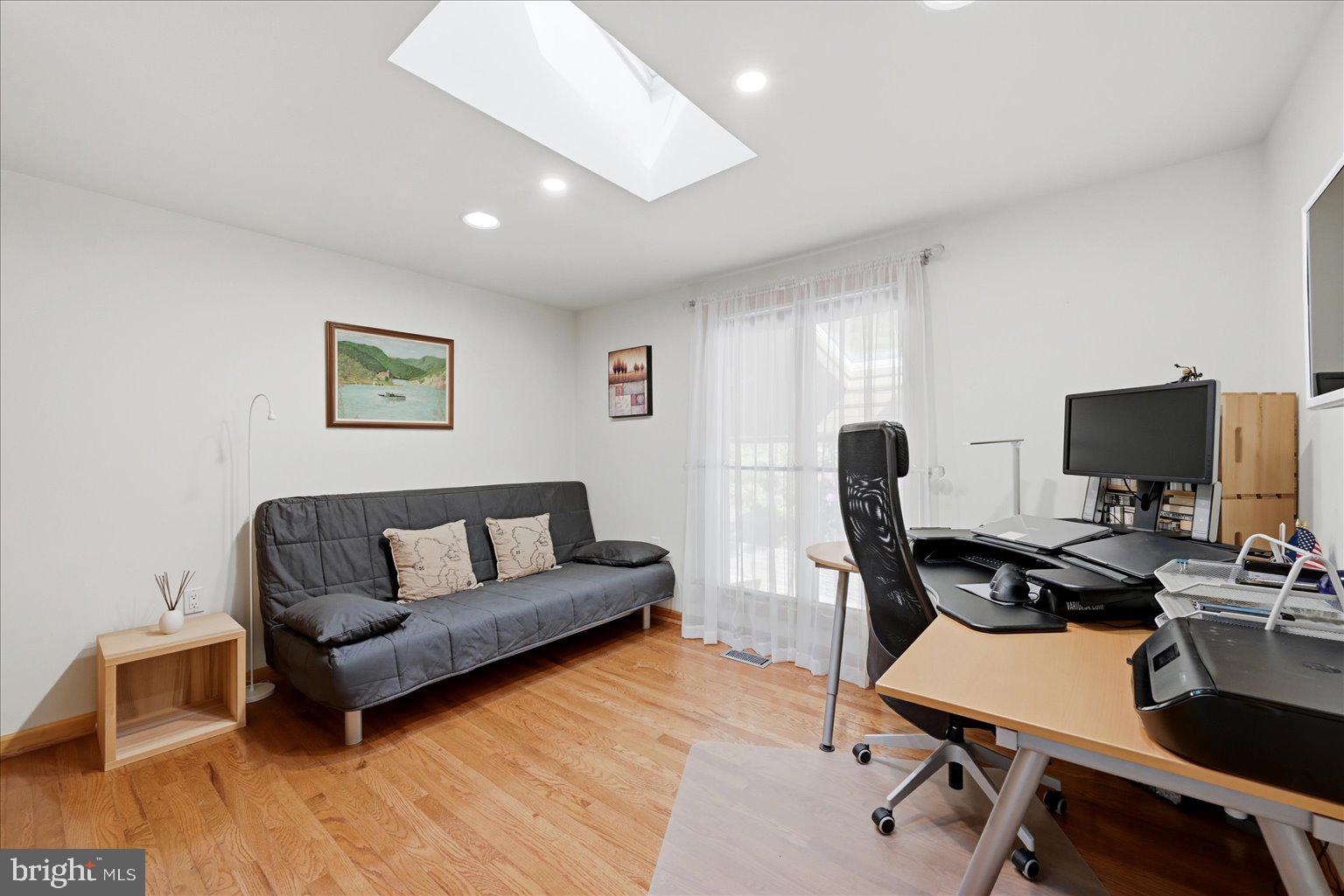 10929 Howland Drive Reston, VA 20191 - Photo 33 of 66 a living room with furniture and a flat screen tv