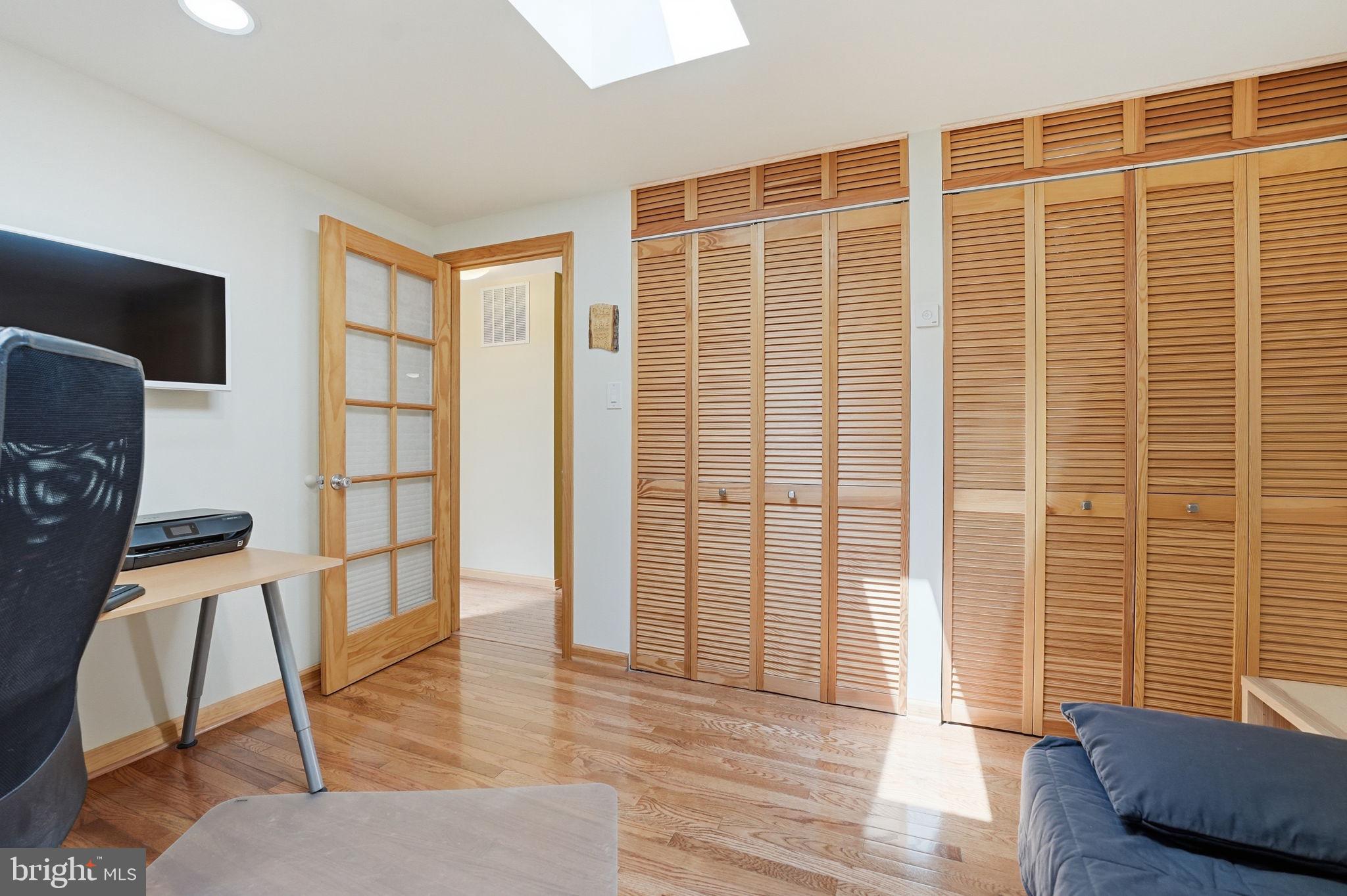 10929 Howland Drive Reston, VA 20191 - Photo 34 of 66 a view of empty room with wooden floor and windows