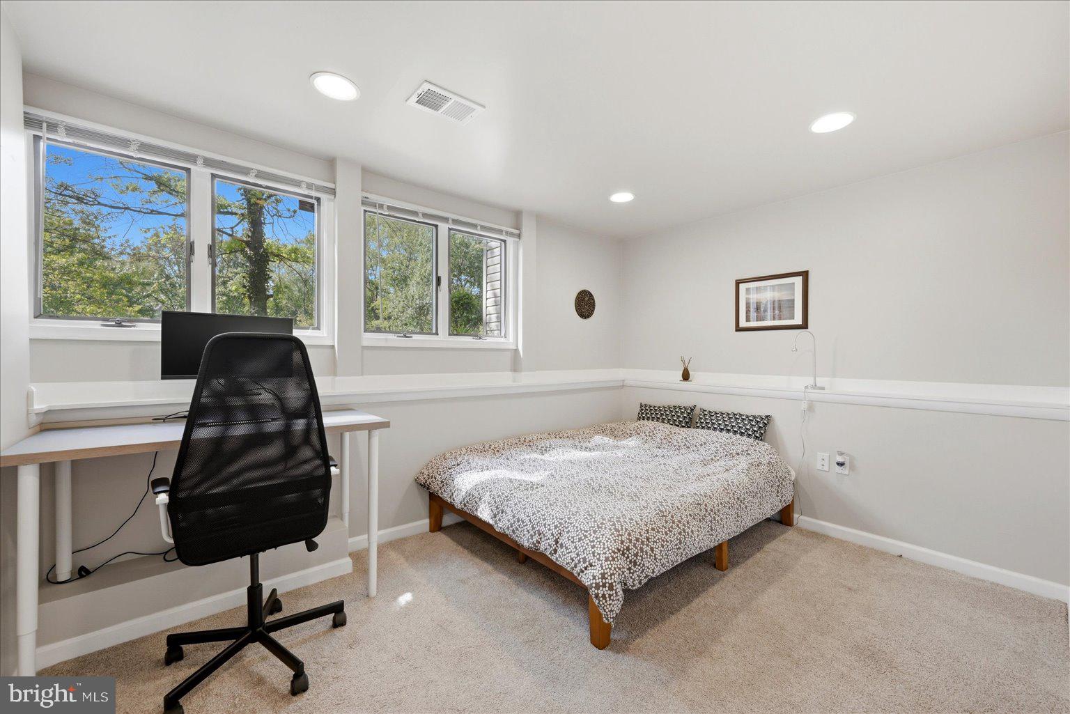 10929 Howland Drive Reston, VA 20191 - Photo 36 of 66 a bedroom with a bed and a window