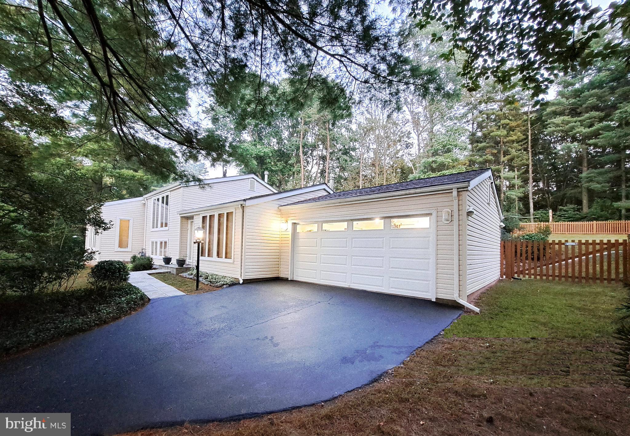 10929 Howland Drive Reston, VA 20191 - Photo 52 of 66 a view of a house with a backyard