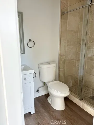 a white toilet sitting next to a bathroom sink