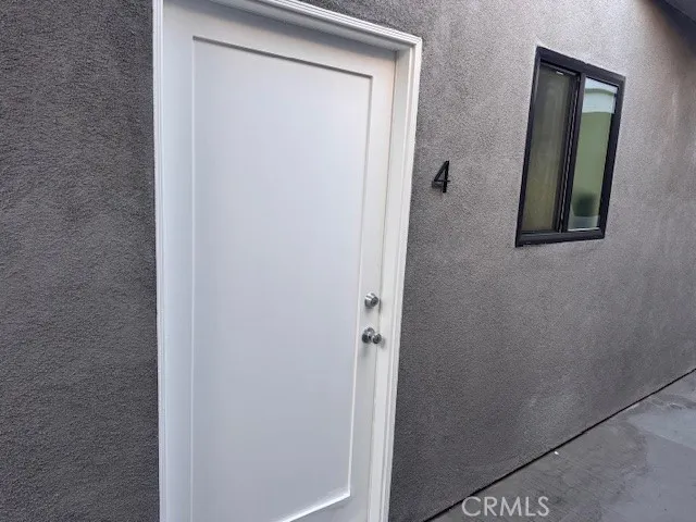 a hallway with sliding door and yard in back