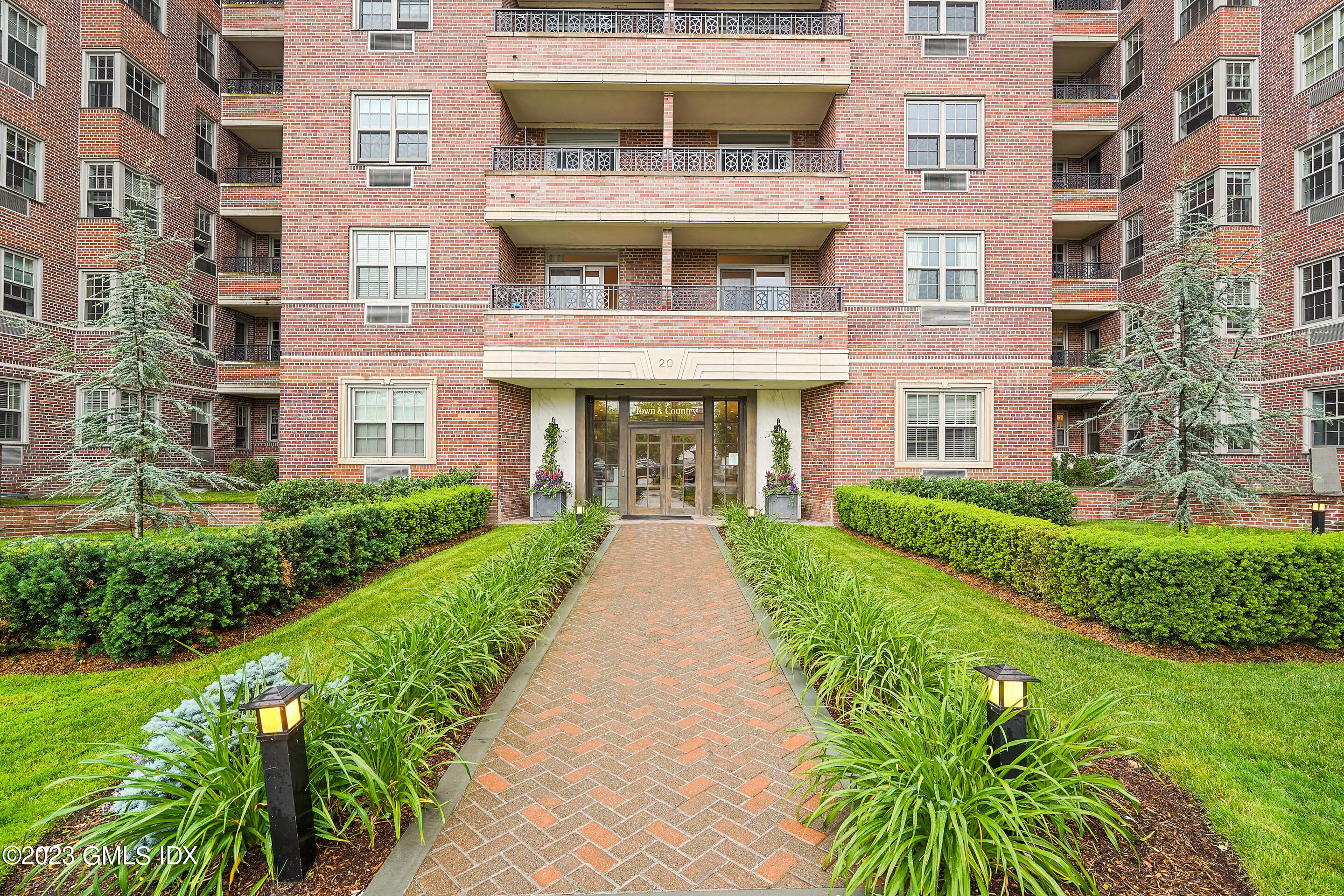 20 Church Street, Unit B35 Greenwich, CT 06830 - Photo 1 of 16 a view of a building with a yard