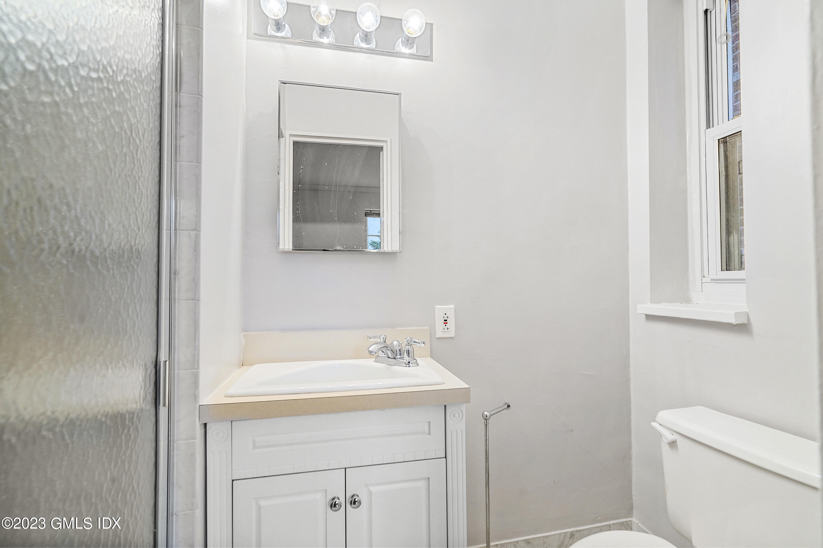 20 Church Street, Unit B35 Greenwich, CT 06830 - Photo 10 of 16 a bathroom with a sink toilet and vanity