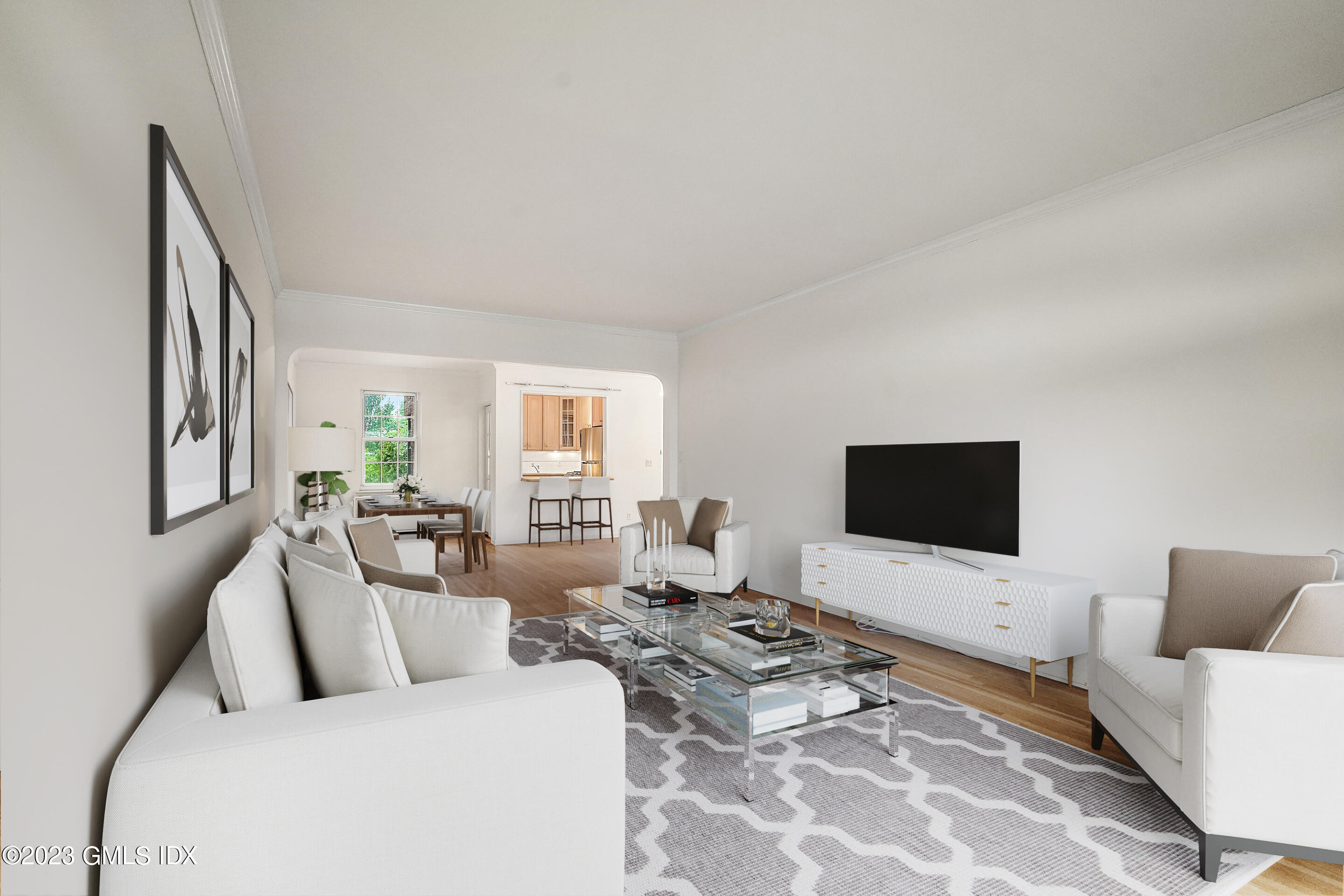 20 Church Street, Unit B35 Greenwich, CT 06830 - Photo 3 of 16 a living room with furniture and a flat screen tv