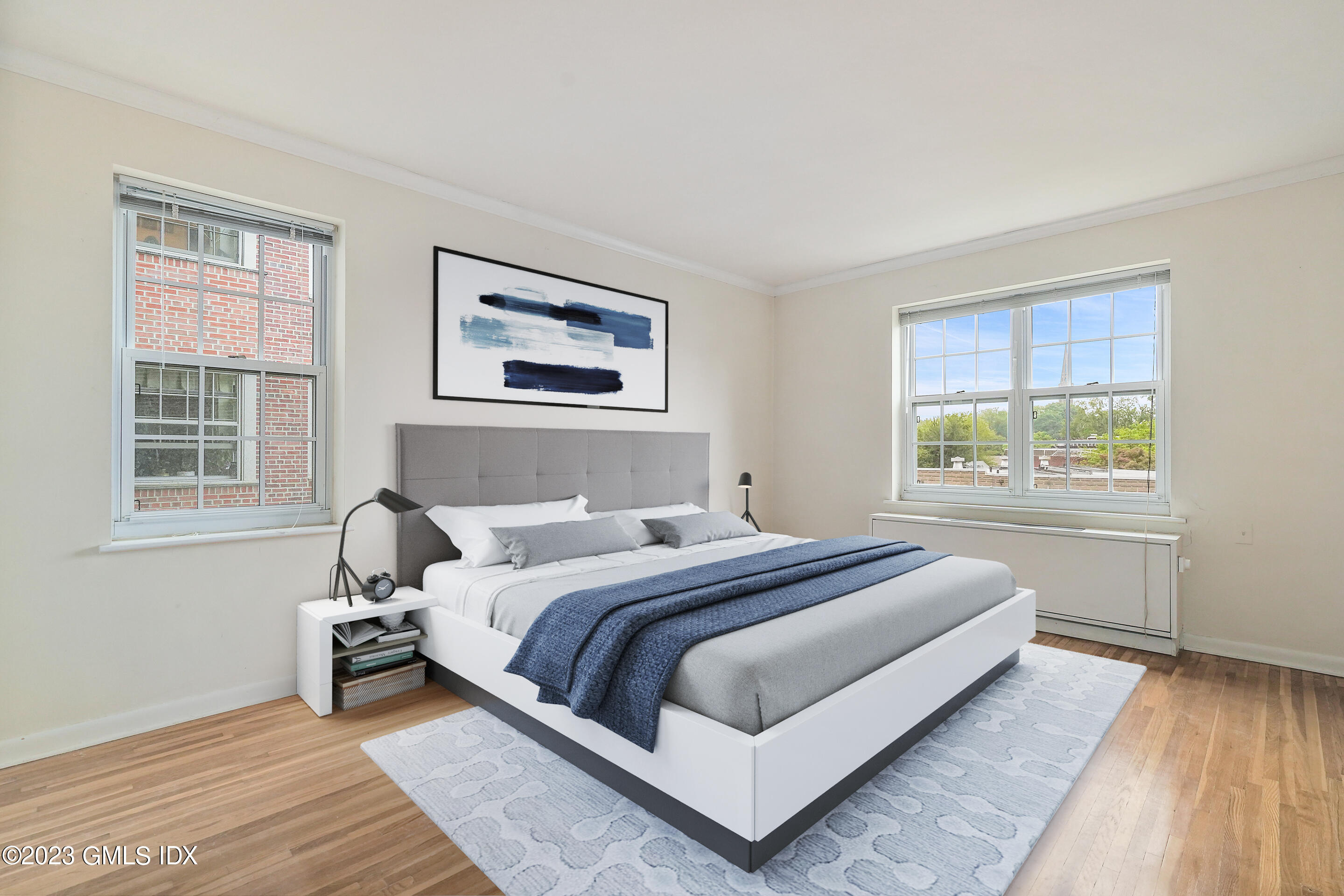 20 Church Street, Unit B35 Greenwich, CT 06830 - Photo 7 of 16 a bedroom with a bed lamp and a window