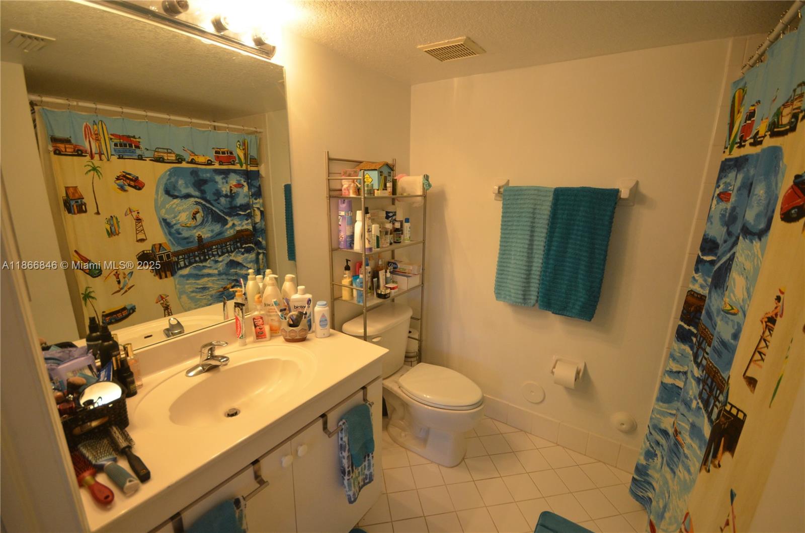 1270 Southeast 27th Street, Unit 101 Homestead, FL 33035 - Photo 20 of 32 a bathroom with a sink toilet and shower