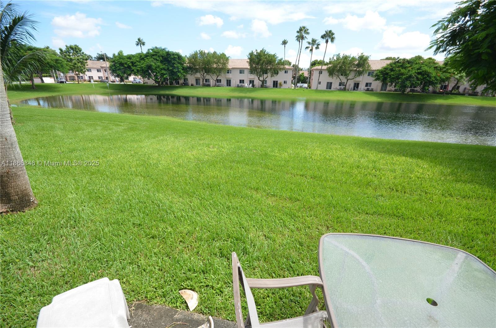 1270 Southeast 27th Street, Unit 101 Homestead, FL 33035 - Photo 30 of 32 a view of a swimming pool and a lake view
