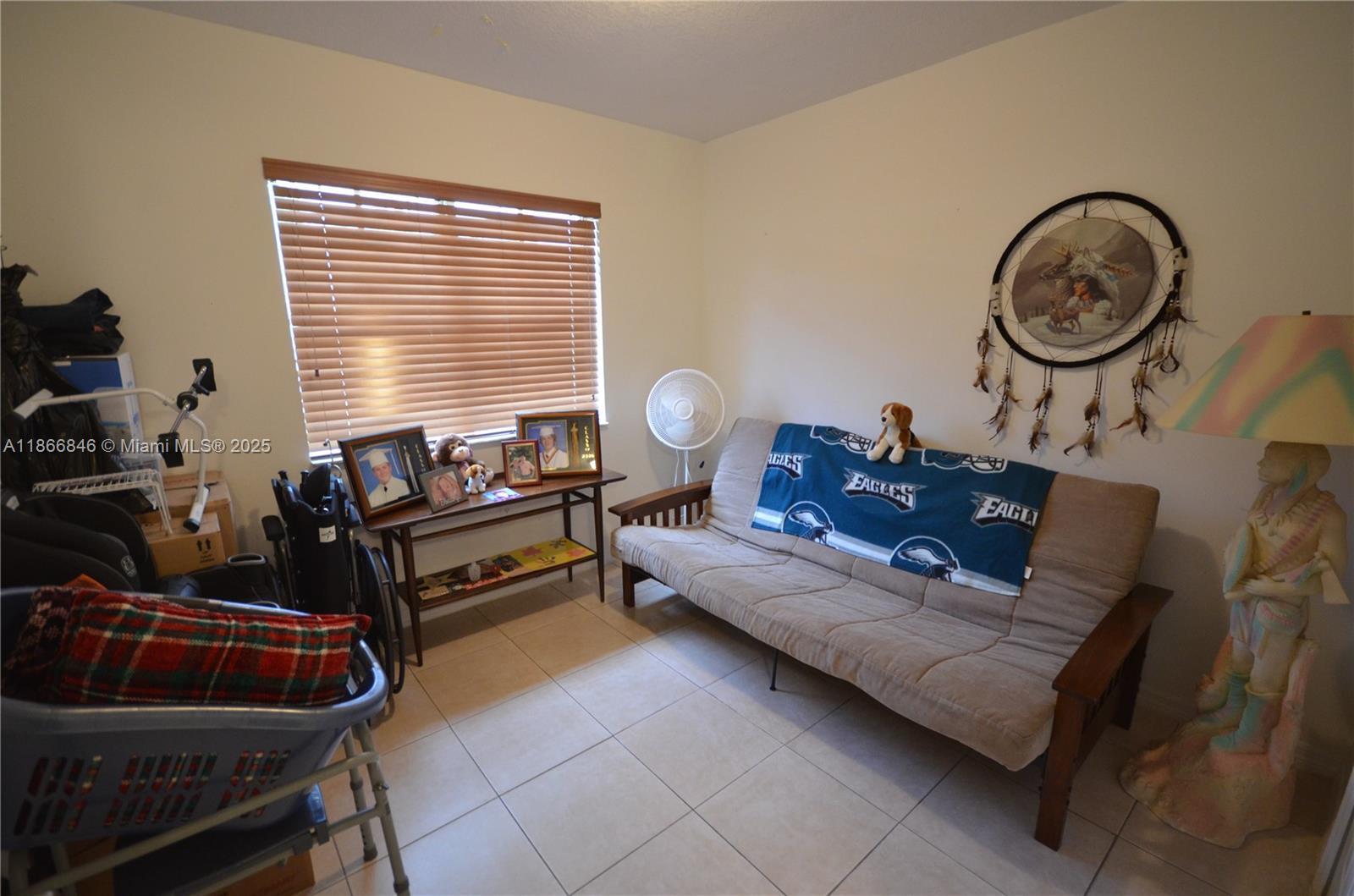 1270 Southeast 27th Street, Unit 101 Homestead, FL 33035 - Photo 9 of 32 a living room with furniture and a wooden floor