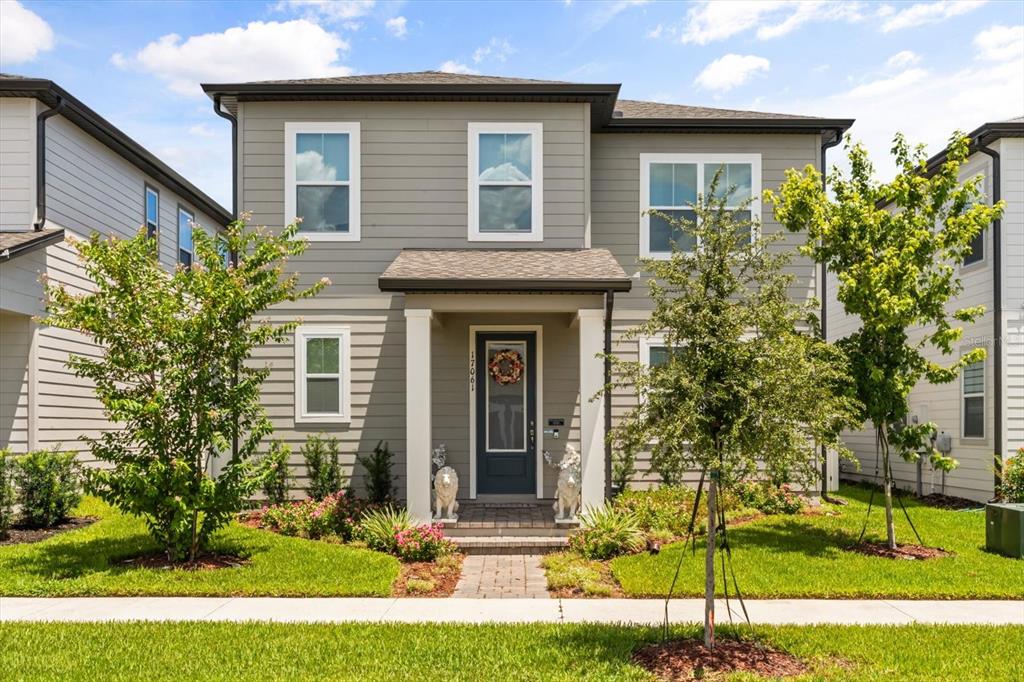 a front view of a house with a yard