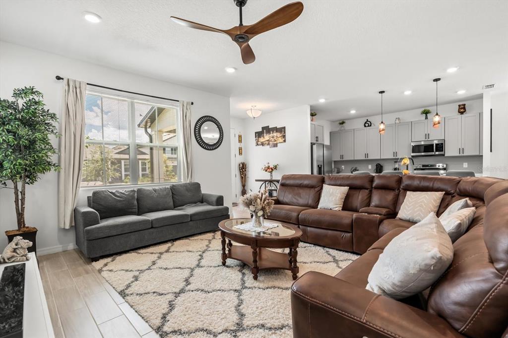 17061 Seville Orange Road Winter Garden, FL 34787 - Photo 11 of 42 a living room with furniture and a large window