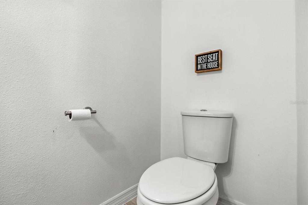 17061 Seville Orange Road Winter Garden, FL 34787 - Photo 14 of 42 a white toilet sitting next to a shower