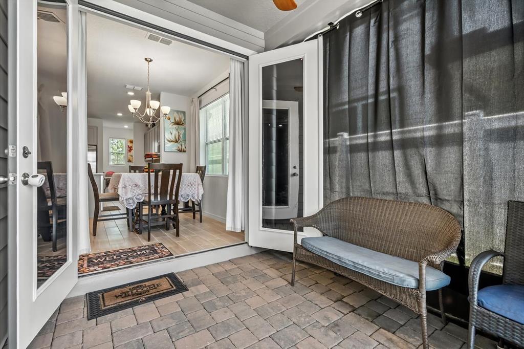 17061 Seville Orange Road Winter Garden, FL 34787 - Photo 18 of 42 a living room with a furniture and a chandelier