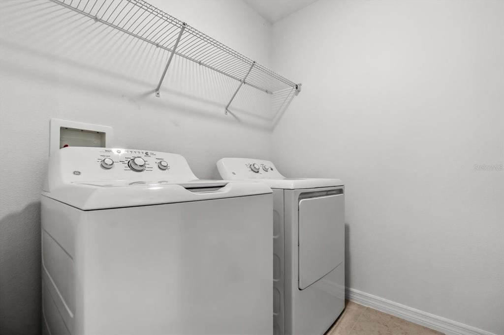 17061 Seville Orange Road Winter Garden, FL 34787 - Photo 27 of 42 a utility room with dryer and washer