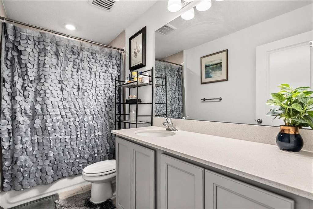 17061 Seville Orange Road Winter Garden, FL 34787 - Photo 28 of 42 a bathroom with a sink a toilet and shower