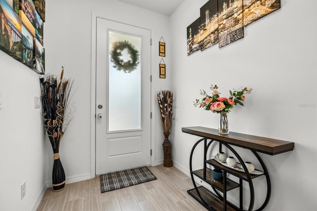 17061 Seville Orange Road Winter Garden, FL 34787 - Photo 3 of 42 a view of a hallway with a flower pot