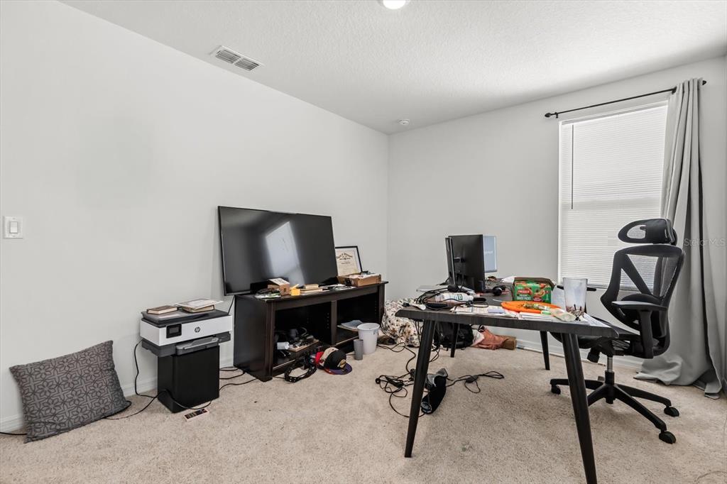 17061 Seville Orange Road Winter Garden, FL 34787 - Photo 33 of 42 a view of a workspace with furniture