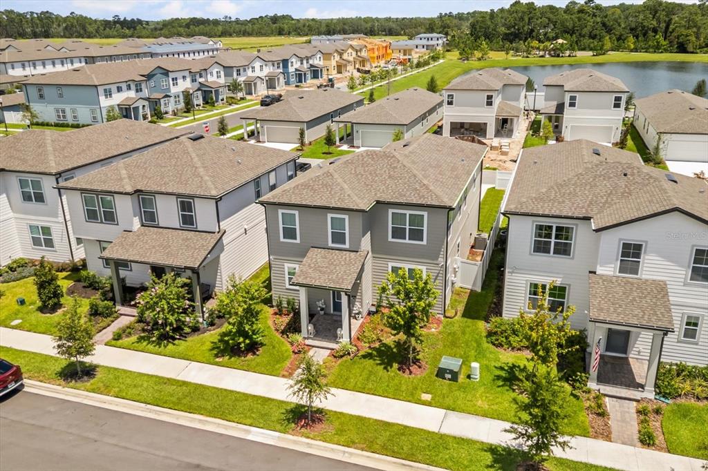 17061 Seville Orange Road Winter Garden, FL 34787 - Photo 35 of 42 an aerial view of residential houses with outdoor space and ocean view