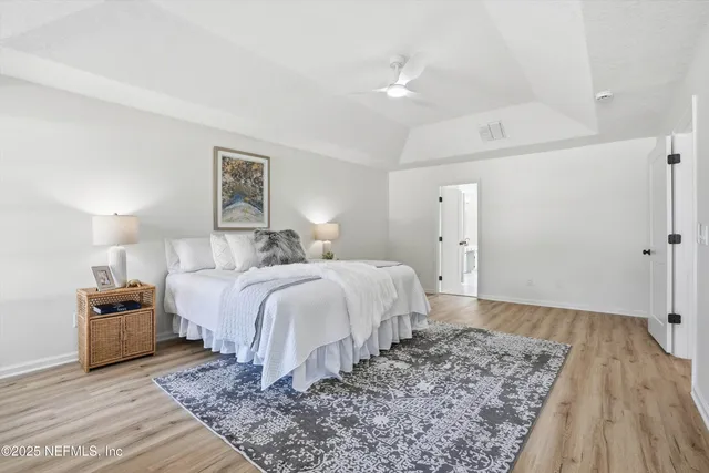 a bedroom with a bed and a couch