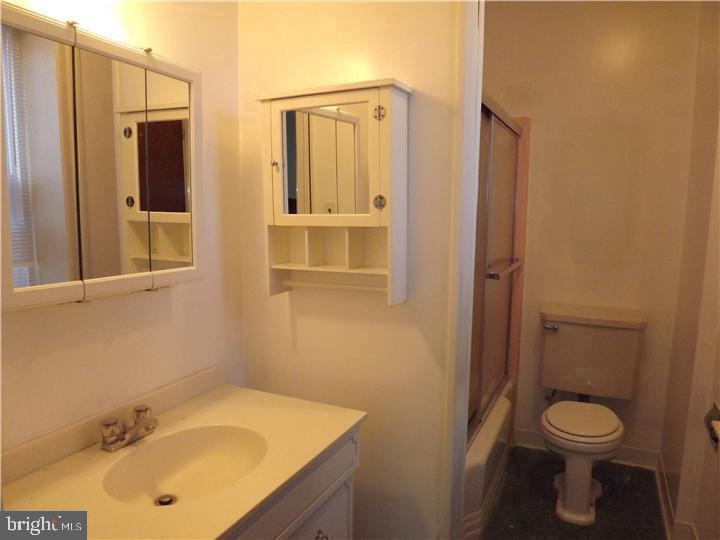 7905 Ardleigh Street, Unit 2 Philadelphia, PA 19118 - Photo 6 of 7 a bathroom with a sink toilet and shower